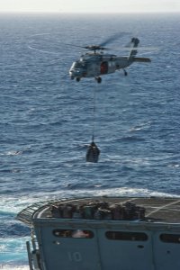 US Navy 111203-N-DX615-142 An MH-60S Sea Hawk helicopter assigned to the Wild Cards of Helicopter Sea Combat Squadron (HSC) 23 transports stores fr