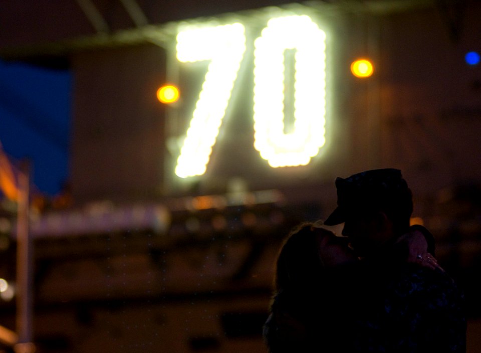 US Navy 111130-N-TZ605-147 Aviation Electronics Technician Ariman Christopher Fowler says goodbye to his wife before the Nimitz-class aircraft carr