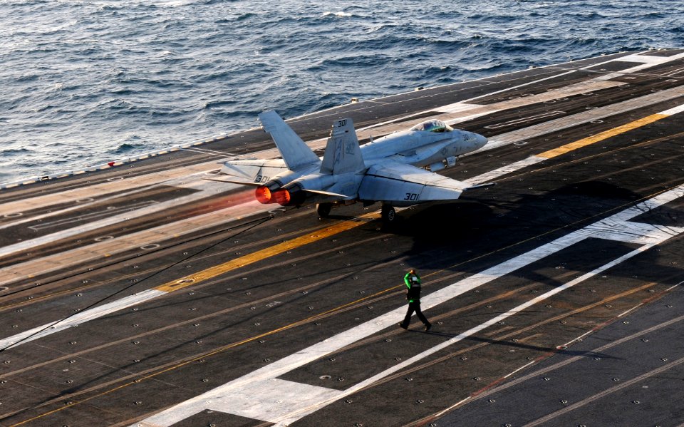 US Navy 111201-N-RG587-420 An F-A-18C Hornet assigned to Strike Fighter Squadron(VFA) 113 lands on the flight deck while conducting carrier qualifi