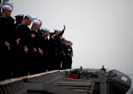 US Navy 111130-N-DR144-584 Sailors wave goodbye to loved ones on the pier while manning the rails as the Nimitz-class aircraft carrier USS Carl Vin