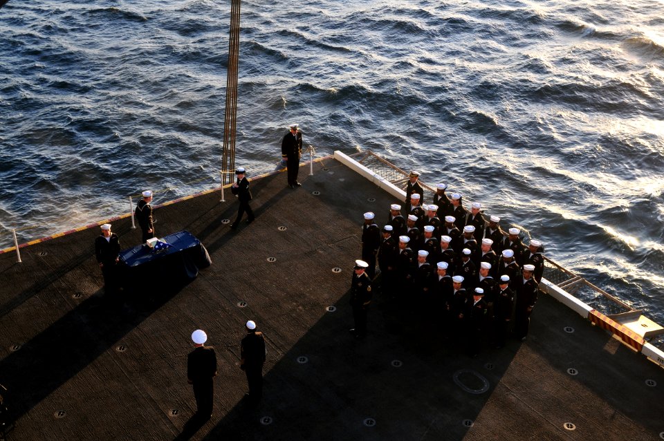 US Navy 111201-N-ZI635-179 Sailors aboard the Nimitz-class aircraft carrier USS Carl Vinson (CVN 70) conduct a burial at sea ceremony for 20 former