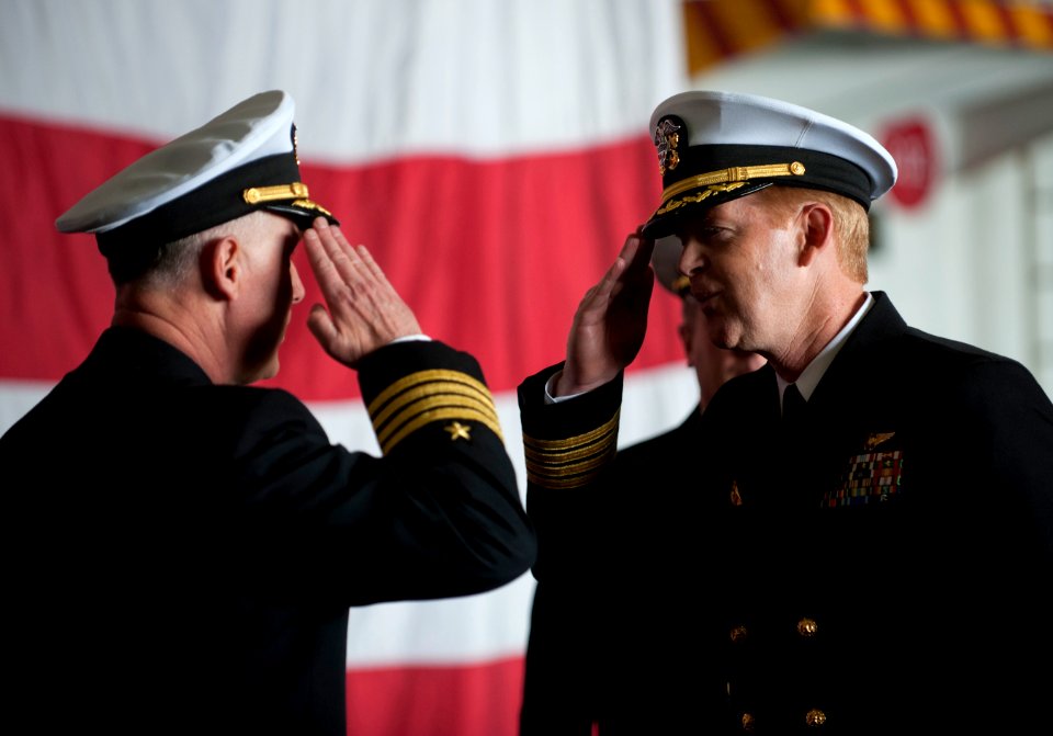 US Navy 111202-N-DR144-497 Capt. Kent D. Whalen, right, relieves Capt. Bruce H. Lindsey as the commanding officer of the Nimitz-class aircraft carr