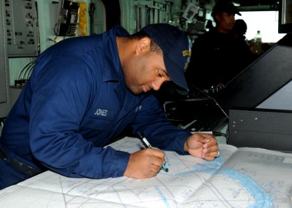 US Navy 111202-N-VE788-006 A Sailor plots the ship's position