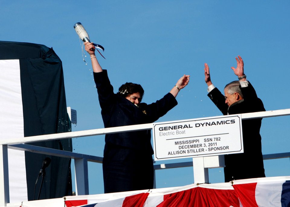 US Navy 111203-N-AW324-151 Ship sponsor Allison Stiller, left, and John Casey, president of General Dynamics Electric boat, celebrate after christe