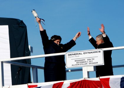 US Navy 111203-N-AW324-151 Ship sponsor Allison Stiller, left, and John Casey, president of General Dynamics Electric boat, celebrate after christe photo