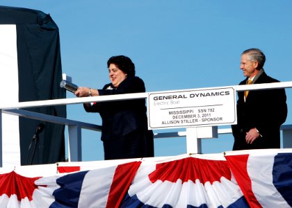 US Navy 111203-N-AW324-148 Ship sponsor Allison Stiller, left, prepares to christen the Virginia-class attack submarine Pre-Commissioning Unit (PCU photo