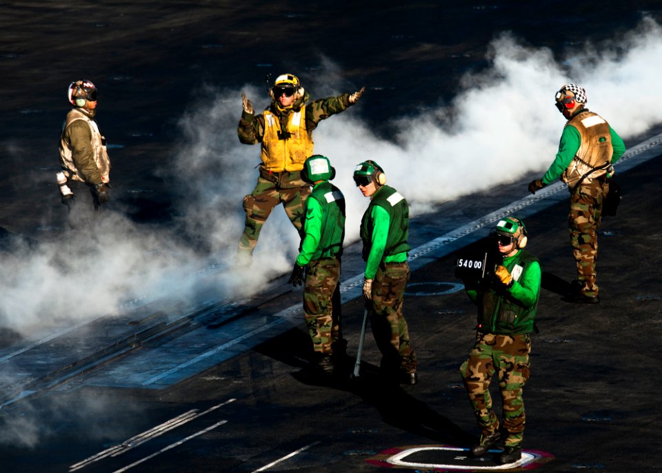 US Navy 111203-N-BT887-416 Sailors prepare to launch aircraft aboard the Nimitz-class aircraft carrier USS John C. Stennis (CVN 74)