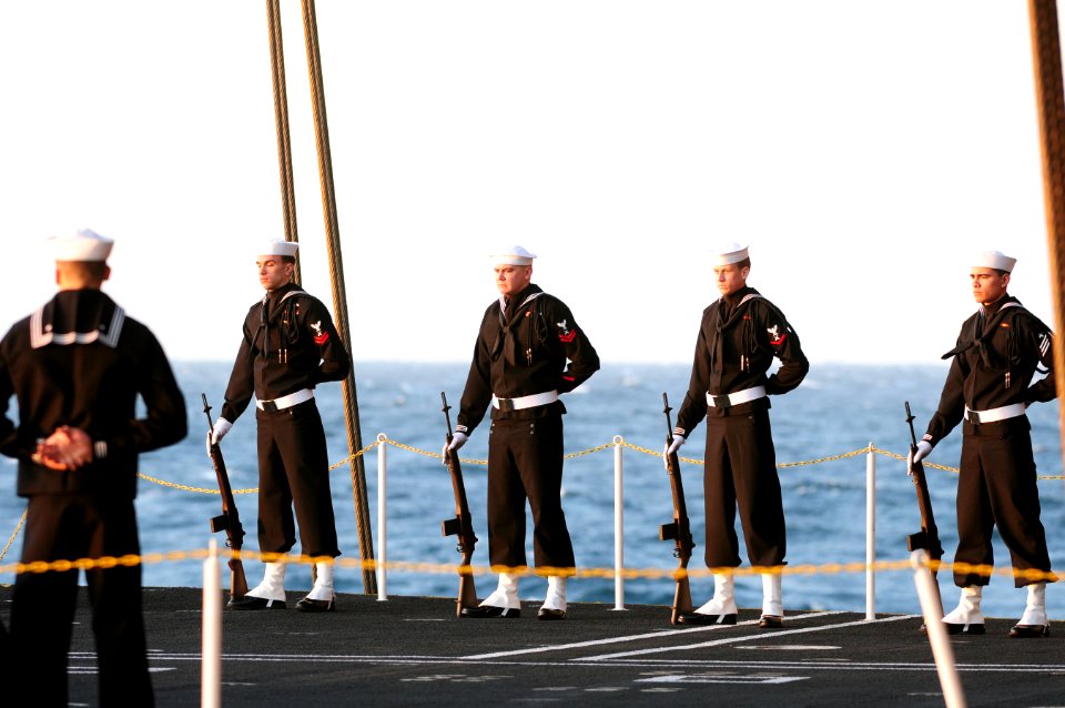 US Navy 111201-N-RG587-007 A rifle detail aboard the Nimitz-class aircraft carrier USS Carl Vinson (CVN 70) stands at parade rest during a burial a