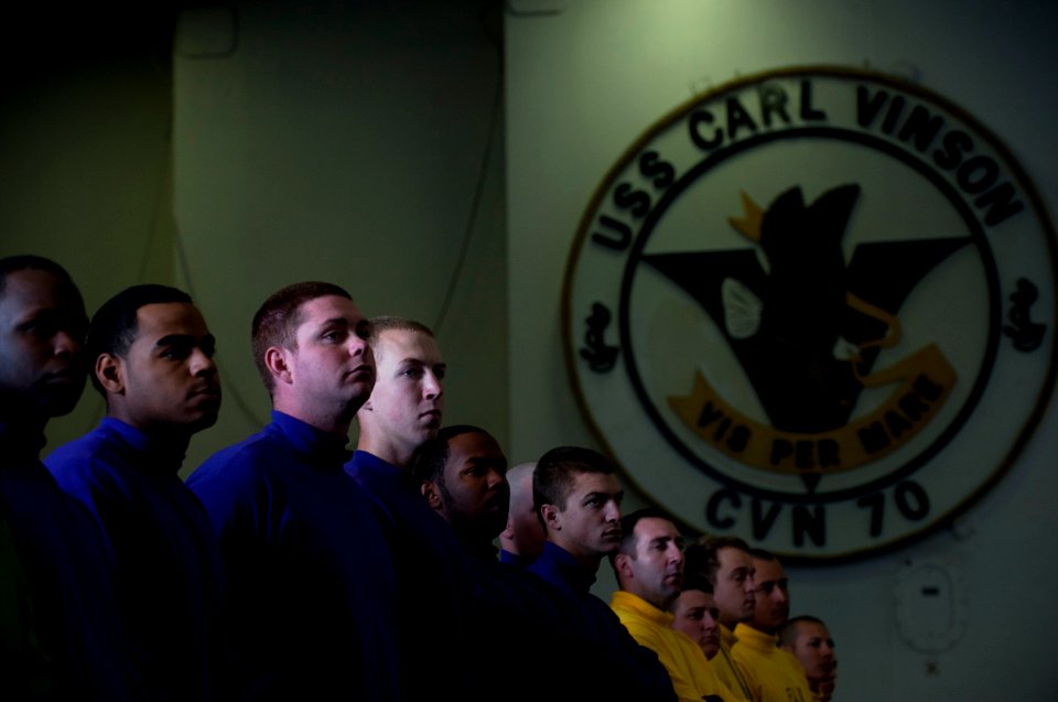 US Navy 111202-N-DR144-218 Sailors listen as CO delivers his farewell address