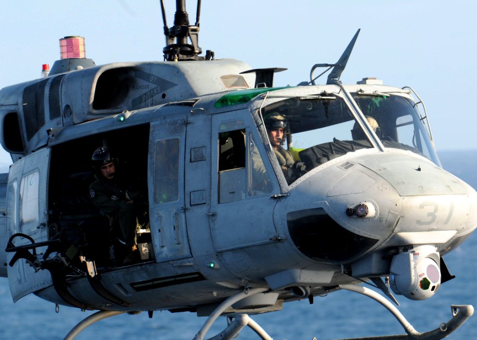 US Navy 111205-N-VE788-017 An AH-1 Cobra helicopter assigned to Marine Medium Tiltrotor Squadron (VMM) 261 lands aboard the multi-purpose amphibiou