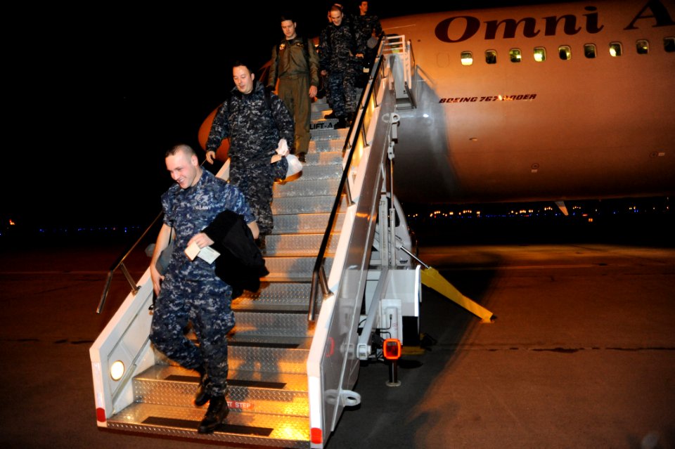 US Navy 111203-N-KK192-065 Sailors assigned to Patrol Squadron (VP) 1 disembark an aircraft after arriving for deployment