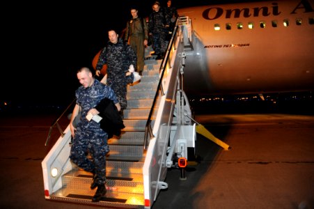 US Navy 111203-N-KK192-065 Sailors assigned to Patrol Squadron (VP) 1 disembark an aircraft after arriving for deployment