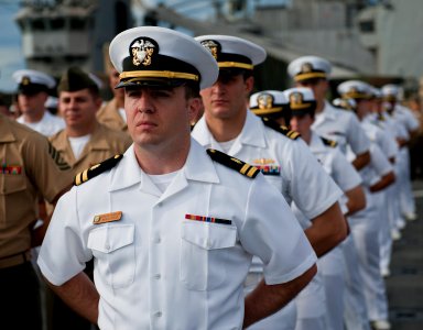US Navy 111207-N-DX615-009 Lt. Steven Shelden stands in ranks with Sailors and Marines aboard the amphibious dock landing ship USS Pearl Harbor (LS