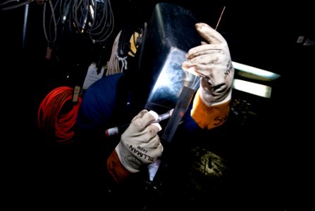 US Navy 111203-N-GC412-307 A Sailor practices welding for a shipboard qualification