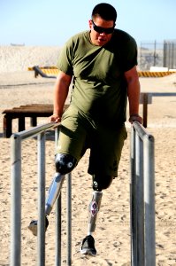 US Navy 111202-N-JR159-026 A wounded service member from Naval Medical Center San Diego participates in the obstacle course at the Naval Special Wa