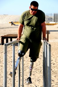 US Navy 111202-N-JR159-026 A wounded service member from Naval Medical Center San Diego participates in the obstacle course at the Naval Special Wa photo