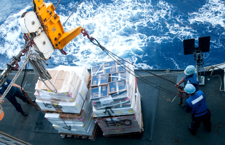 US Navy 111203-N-PB383-574 The amphibious transport dock ship USS New Orleans (LPD 18) receives a pallet of supplies from the Military Sealift Comm