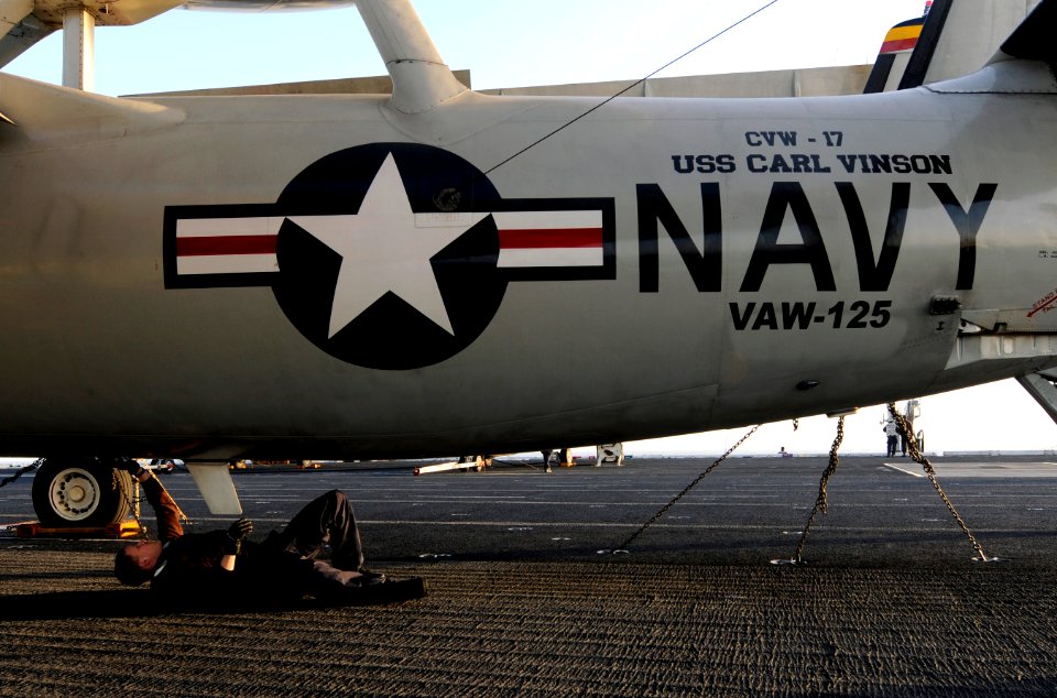 US Navy 111202-N-GZ277-045 Aviation Electrician's Mate Airman Joseph Hallman, assigned to Carrier Airborne Early Warning Squadron (VAW) 125, cleans