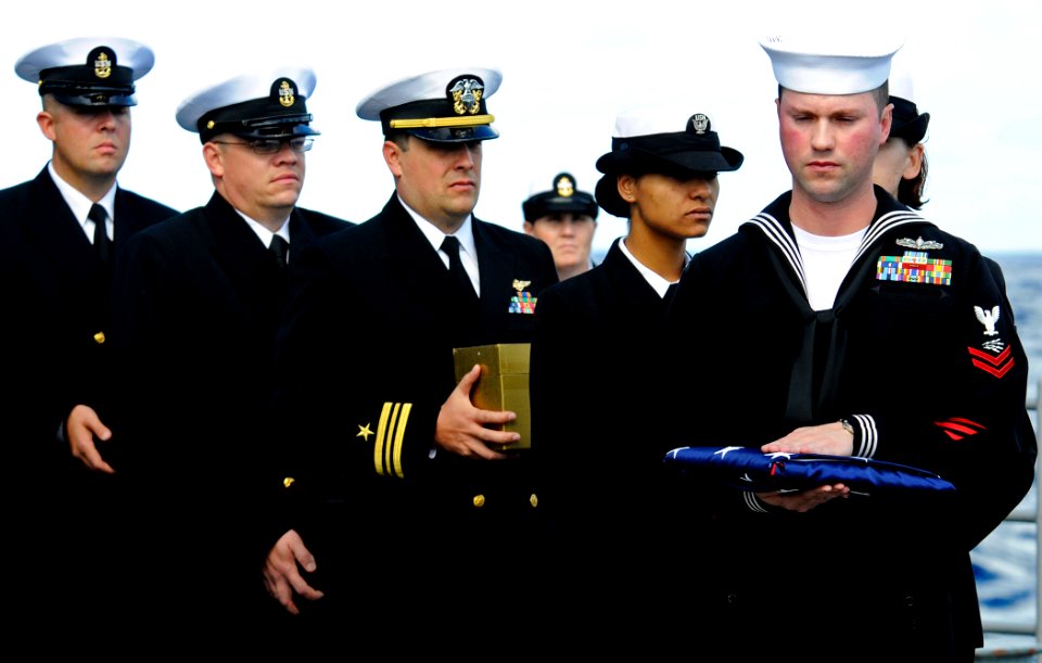 US Navy 111207-N-BC134-002 Sailors aboard the guided-missile cruiser USS Bunker Hill (CG 52) prepare cremated remains for committal during a burial
