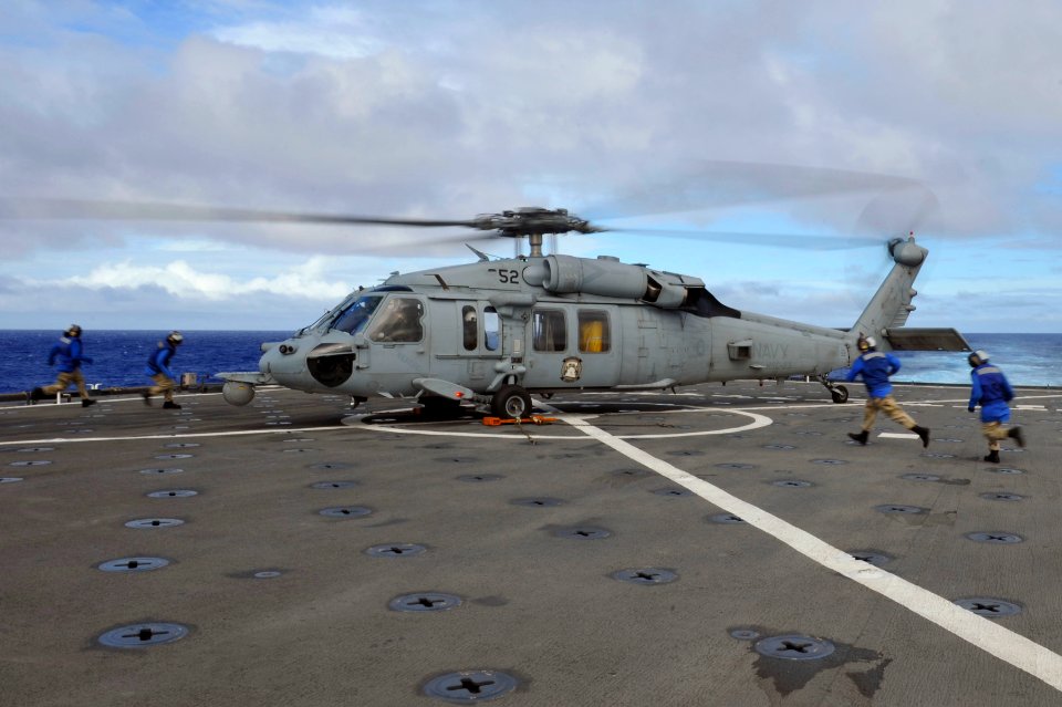 US Navy 111202-N-KS651-420 Sailors approach Sea Hawk helicopter on the flight deck