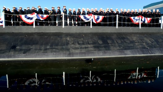 US Navy 111203-N-UM744-002 Sailors assigned to the Virginia-class attack submarine Pre-Commissioning Unit (PCU) Mississippi (SSN 782) look on as Se photo