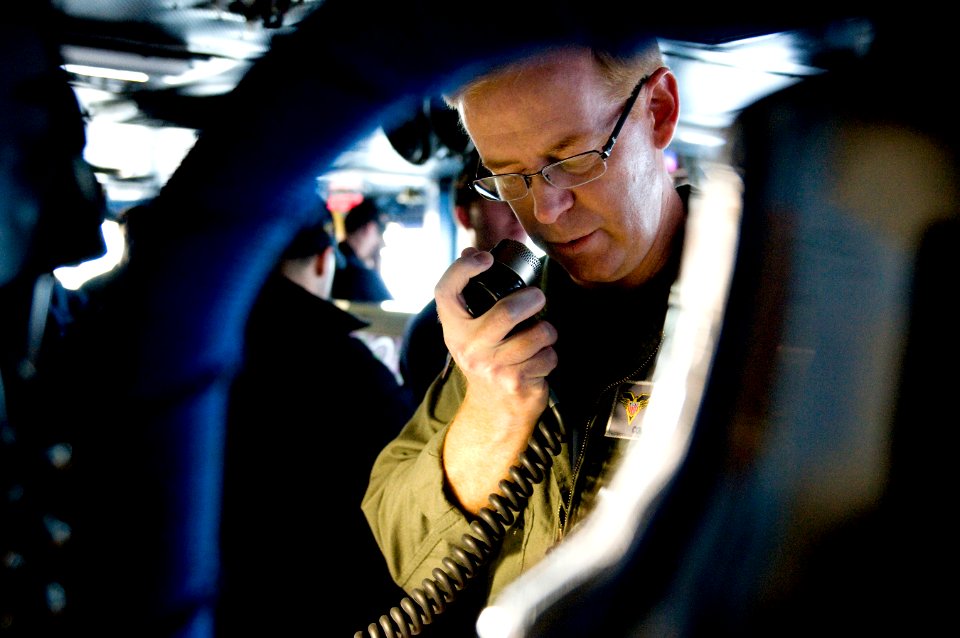 US Navy 111207-N-GZ832-022 Capt. Kent D. Whalen, commanding officer of the aircraft carrier USS Carl Vinson (CVN 70), makes a 1MC address to the cr
