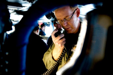 US Navy 111207-N-GZ832-022 Capt. Kent D. Whalen, commanding officer of the aircraft carrier USS Carl Vinson (CVN 70), makes a 1MC address to the cr