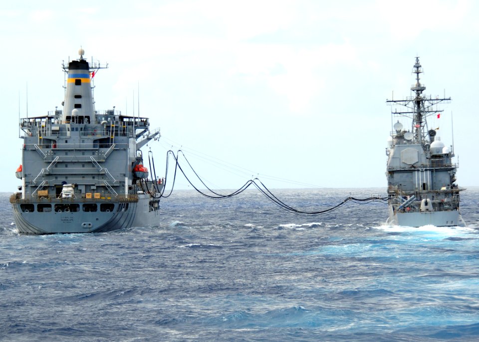 US Navy 111206-N-ZF681-331 The guided-missile cruiser USS Bunker Hill (CG 52) conducts a replenishment at sea with the Military Sealift Command fle