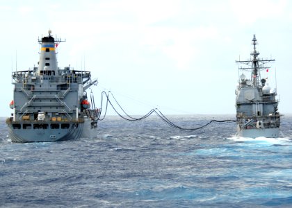 US Navy 111206-N-ZF681-331 The guided-missile cruiser USS Bunker Hill (CG 52) conducts a replenishment at sea with the Military Sealift Command fle