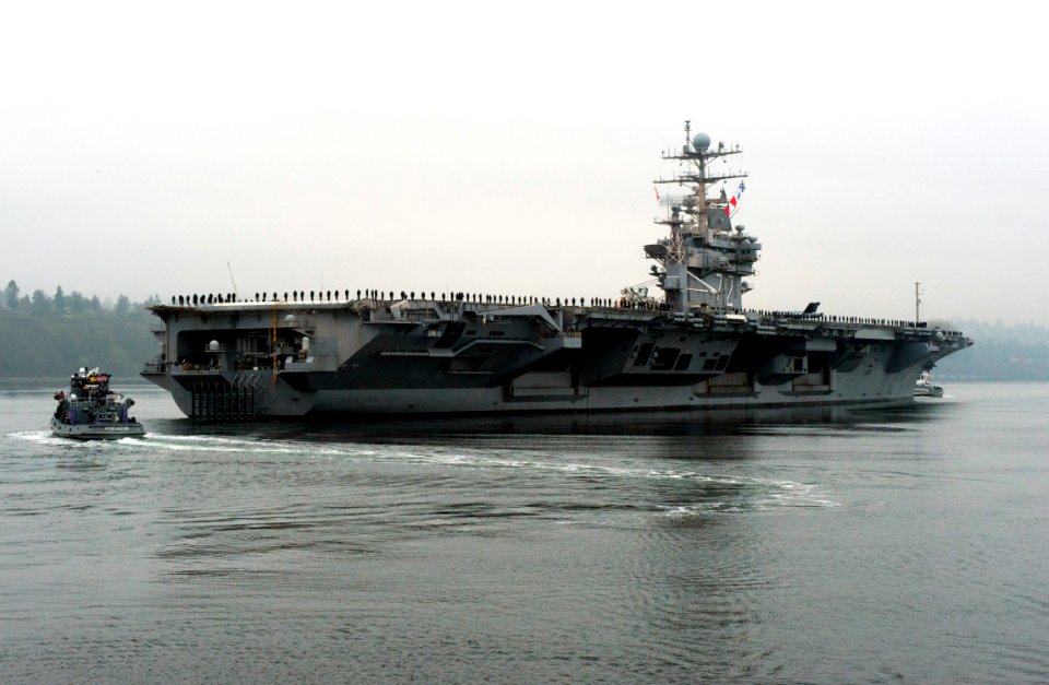 US Navy 111207-N-RG482-036 The Nimitz-class aircraft carrier USS Abraham Lincoln (CVN 72) departs Naval Station Everett for the last time as it beg