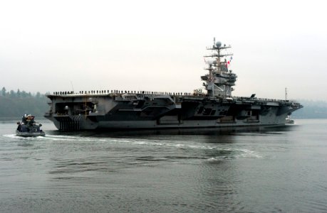 US Navy 111207-N-RG482-036 The Nimitz-class aircraft carrier USS Abraham Lincoln (CVN 72) departs Naval Station Everett for the last time as it beg photo