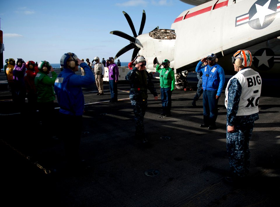 US Navy 111203-N-DR144-031 Vice Adm. Allen G. Myers, Commander, Naval Air Forces, passes through sideboys on the flight deck of the Nimitz-class ai