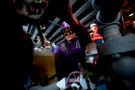 US Navy 111206-N-OY799-154 A Sailor collects fuel samples