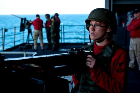 US Navy 111207-N-BT887-204 Aviation Ordnanceman 3rd Class Emily Walker, from Nashville, Ind., prepares to fire a .50-caliber machine gun during a l