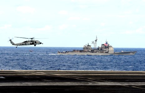 US Navy 111209-N-QL471-353 Helicopter performs a fly-by