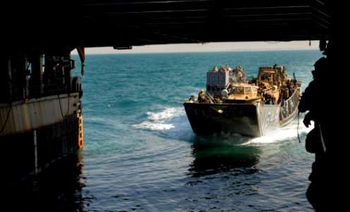 US Navy 111207-N-KA046-035 A landing craft utility from Assault Craft Unit (ACU) 2 enters the well deck of the amphibious dock landing ship USS Whi photo