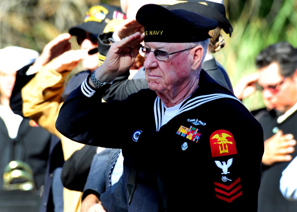 US Navy 111207-N-YM863-211 A former WWII Sailor salutes as taps is played during the Pearl Harbor Remembrance Ceremony