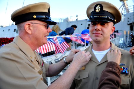US Navy 111214-N-AW702-006 A Sailor is pinned as chief by his father