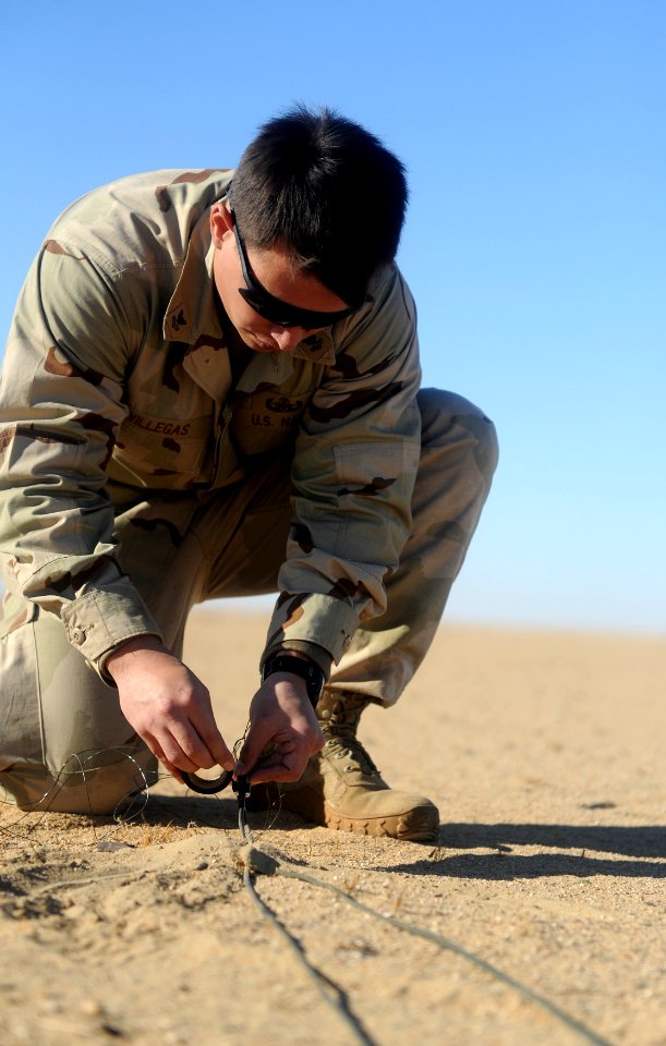 US Navy 111213-N-BA263-455 Explosive Ordnance Disposal Technician 2nd Class Reuban Villegas, assigned to Commander, Task Group (CTG) 56.1, prepares