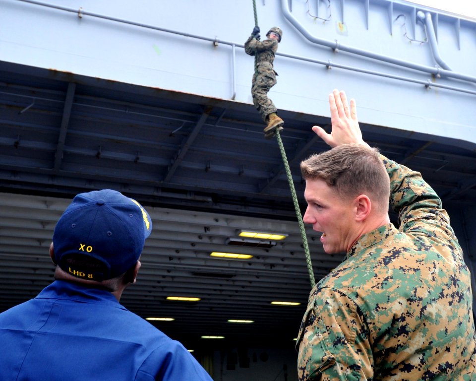 US Navy 111209-N-KD852-148 Capt. Cedric Pringle, executive officer of the amphibious assault ship USS Makin Island (LHD 8), observes Marines assign