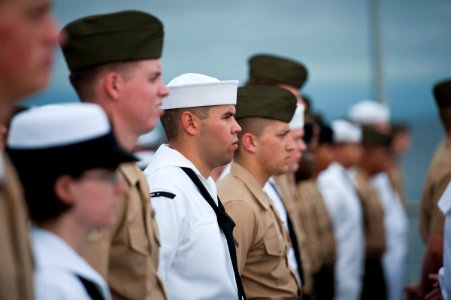 US Navy 111207-N-DX615-095 Sailors and Marines stand in ranks during a remembrance ceremony aboard the amphibious dock landing ship USS Pearl Harbo