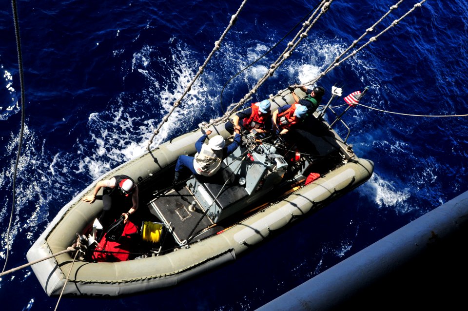 US Navy 111208-N-ZI635-046 Sailors launch a rigid-hull inflatable boat during a man overboard drill aboard the Nimitz-class aircraft carrier USS Ca