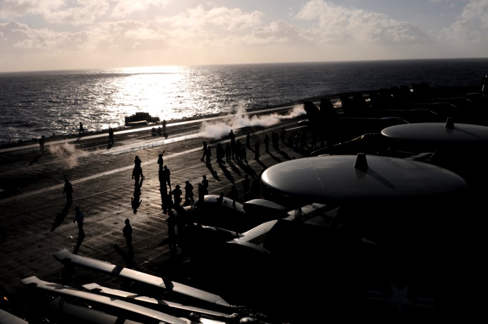 US Navy 111207-N-YC505-001 Sailors on the flight deck prepare for the fly-off of embarked Carrier Air Wing