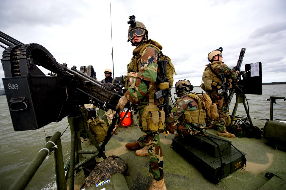 US Navy 111207-N-PC102-050 Sailors aboard Riverine Command Boat 803, assigned to Riverine Squadron (RIVRON) 1, man their positions as gunners while