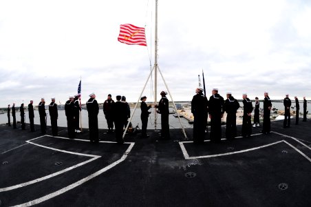 US Navy 111208-N-QL471-201 Sailors raise the Union Jack during morning colors aboard the aircraft carrier USS George H.W. Bush (CVN 77) as the ship photo