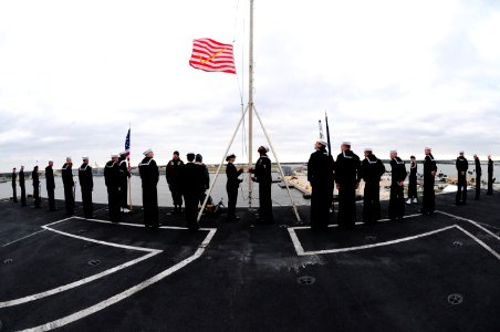 US Navy 111208-N-QL471-201 Sailors raise the Union Jack during morning colors aboard the aircraft carrier USS George H.W. Bush (CVN 77) as the ship