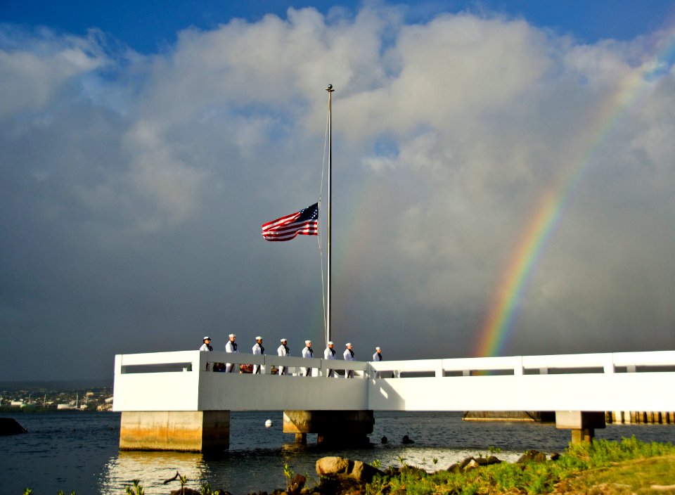 US Navy 111206-N-RI884-218 Members of the Navy Region Hawaii Ceremonial Guard stand over National Park divers in the water during a burial service