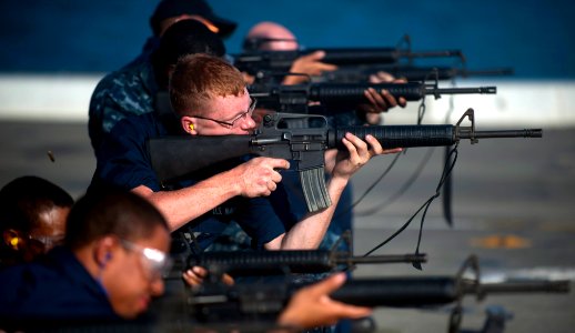 US Navy 111210-N-PB383-726 Sailors fire at their targets with M-16 service rifles during small arms qualifications aboard the amphibious transport