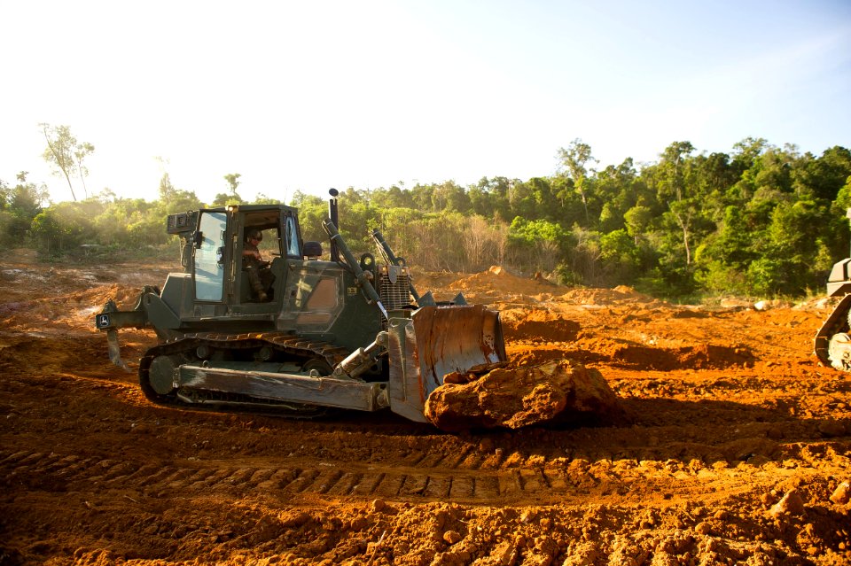 US Navy 111212-M-IS773-039 Heavy equipment operators with the 11th Marine Expeditionary Unit's (11th MEU) logistics combat element move rocks and d