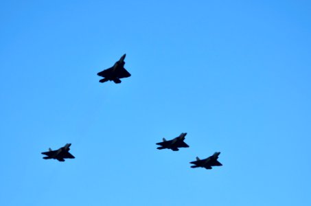 US Navy 111207-N-WP746-260 Jets perform a missing man flyover formation during the 70th anniversary of Pearl Harbor Day